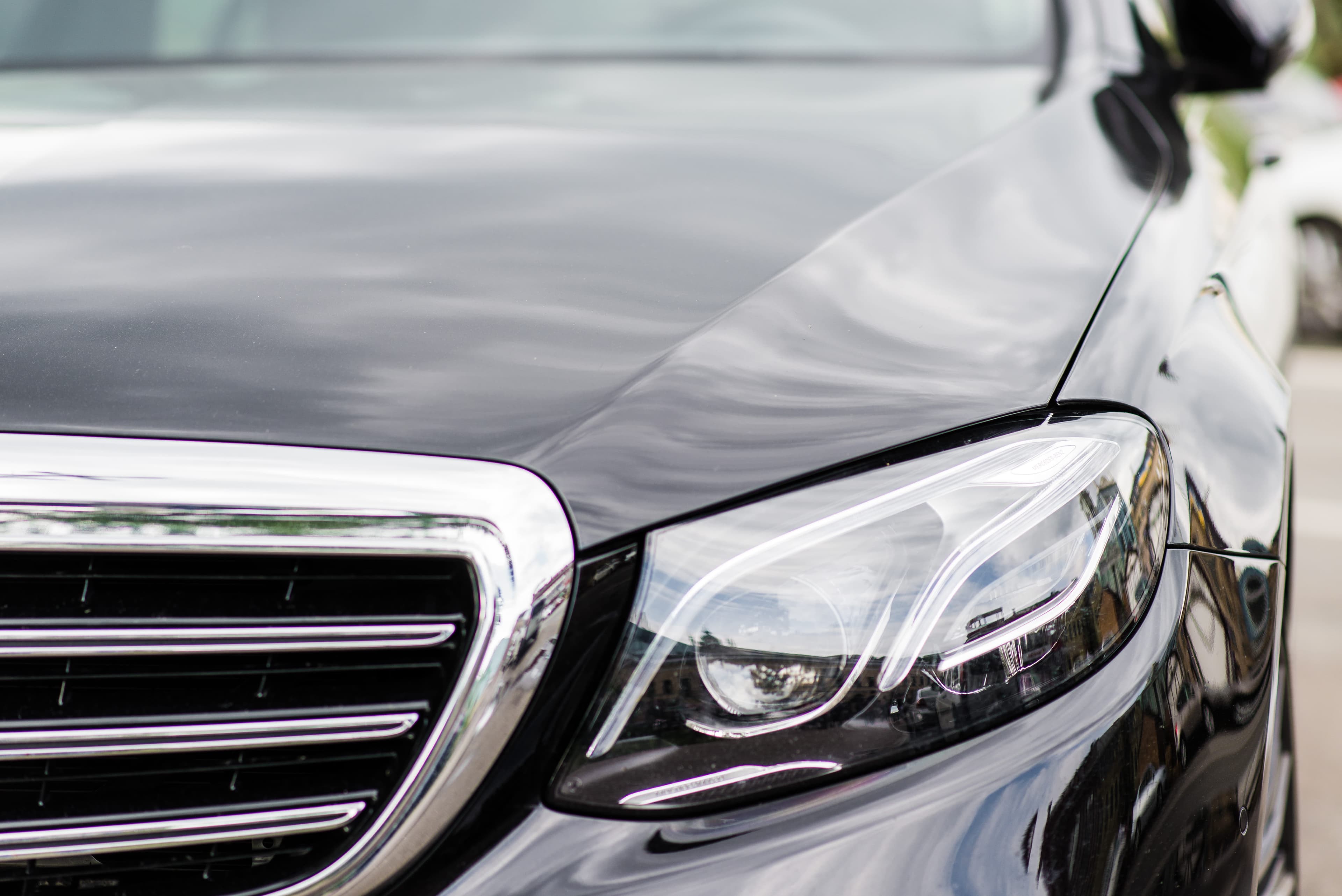The front of a black luxury sedan